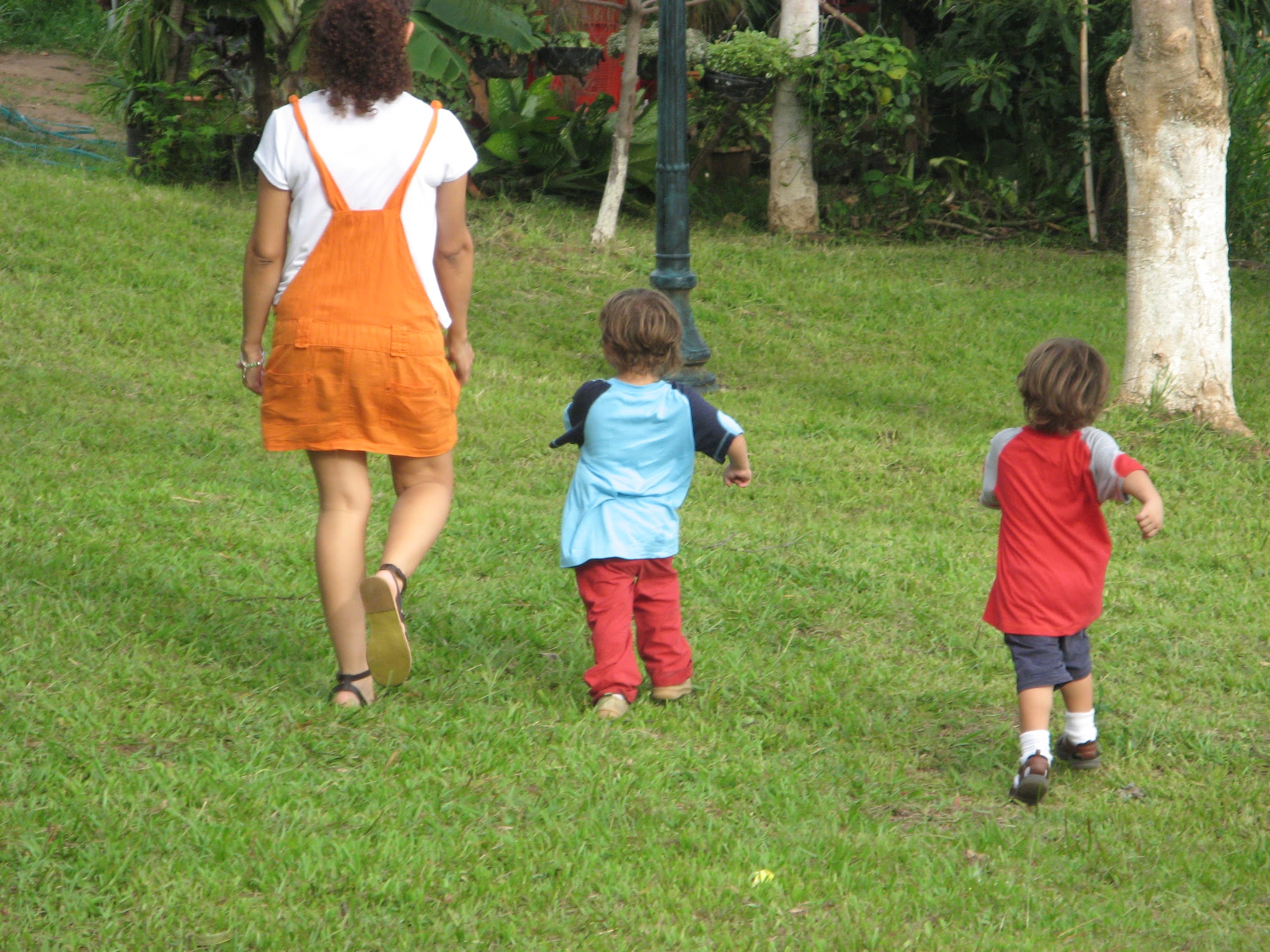 Mother and sons walking